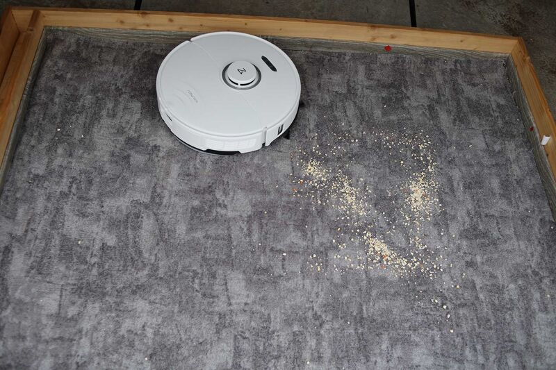 Vacuuming oatmeal on short pile carpet